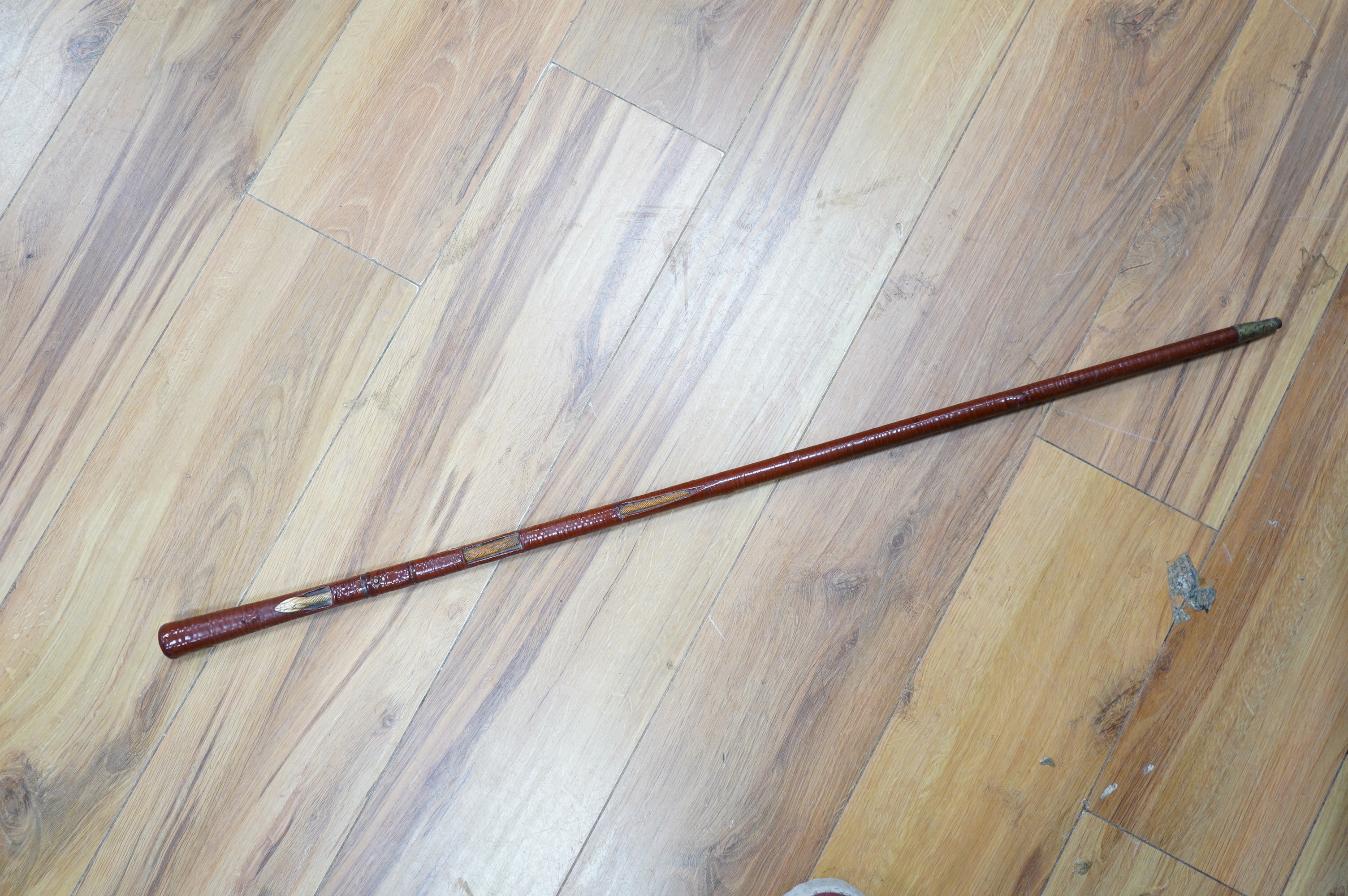 An Edwardian leather covered swordstick with ivory serpent to the shaft, blade 45cm, overall length 89cm. Condition fair to good, minor losses to leather work. CITES Submission reference, CKA5P6DV